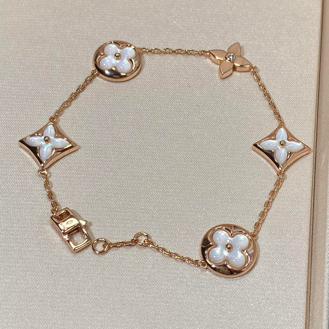 STAR AND SUN 5 MOTIF MOP PINK GOLD BRACELET