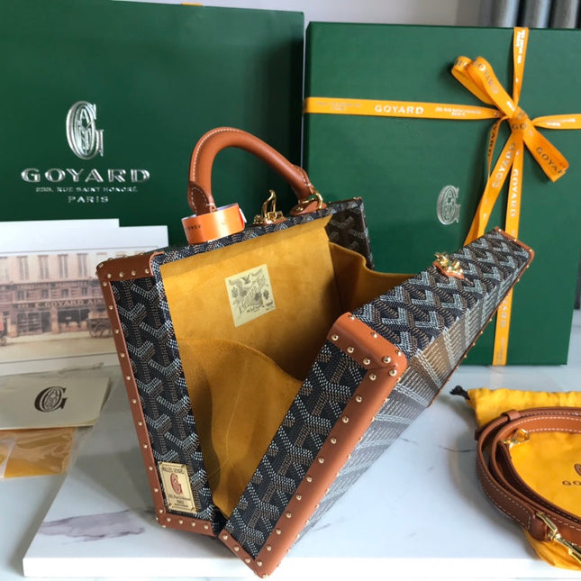GRAND HÔTEL TRUNK BAG 24 IN BLACK GOYARDINE CANVAS AND TAN CALFSKIN