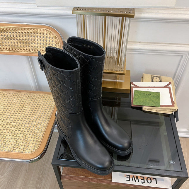 GG EMBOSSED LEATHER ANKLE BOOTS IN BLACK CALFSKIN