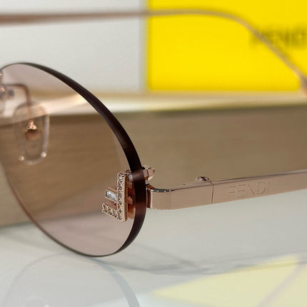FIRST CRYSTAL RIMLESS OVAL FRAME SUNGLASSES FE4075US IN METAL