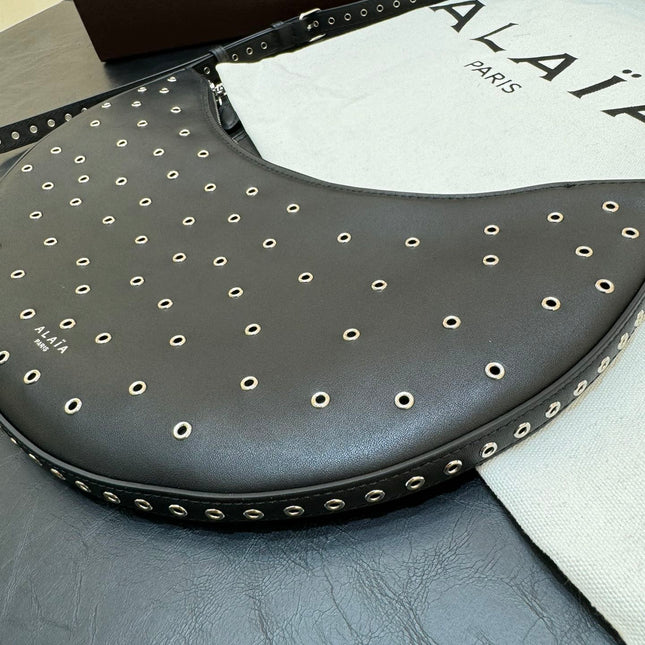 ONE PIECE DEMI LUNE BAG 31 IN BLACK SHEEPSKIN EYELET DETAILING