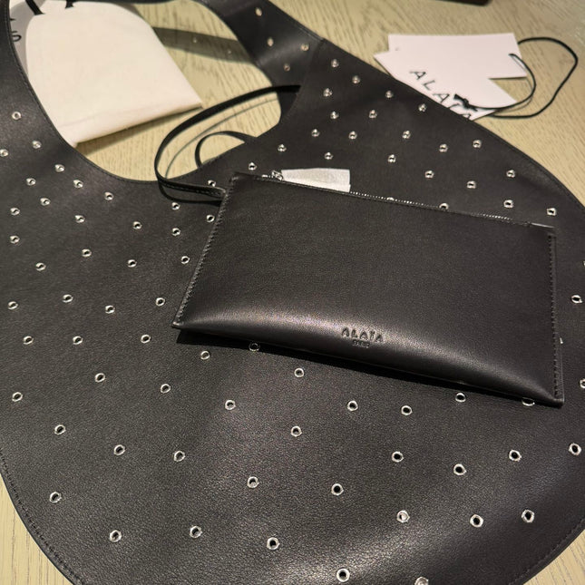ONE PIECE MEDIUM BAG 39 IN BLACK SHEEPSKIN EYELET DETAILING
