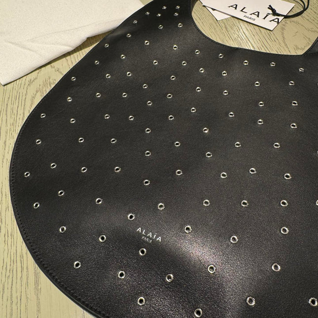 ONE PIECE MEDIUM BAG 39 IN BLACK SHEEPSKIN EYELET DETAILING