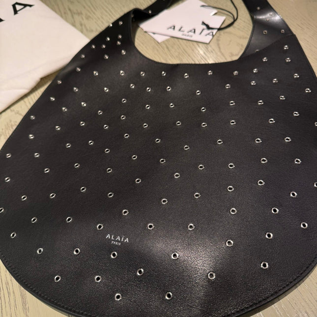 ONE PIECE MEDIUM BAG 39 IN BLACK SHEEPSKIN EYELET DETAILING