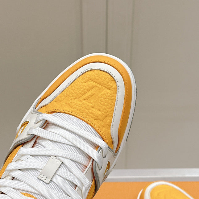 LV TRAINER SNEAKER IN SAFFRAN YELLOW GRAINED CALFSKIN