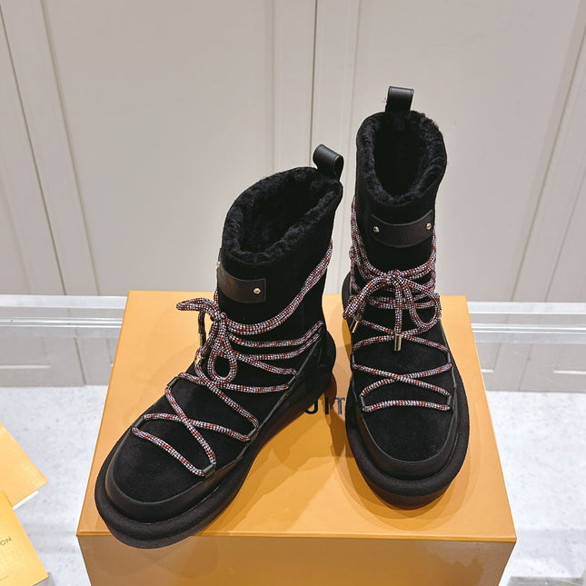ASPEN PLATFORM ANKLE BOOT IN BLACK MONOGRAM DEBOSSED SUEDE AND SHEARLING