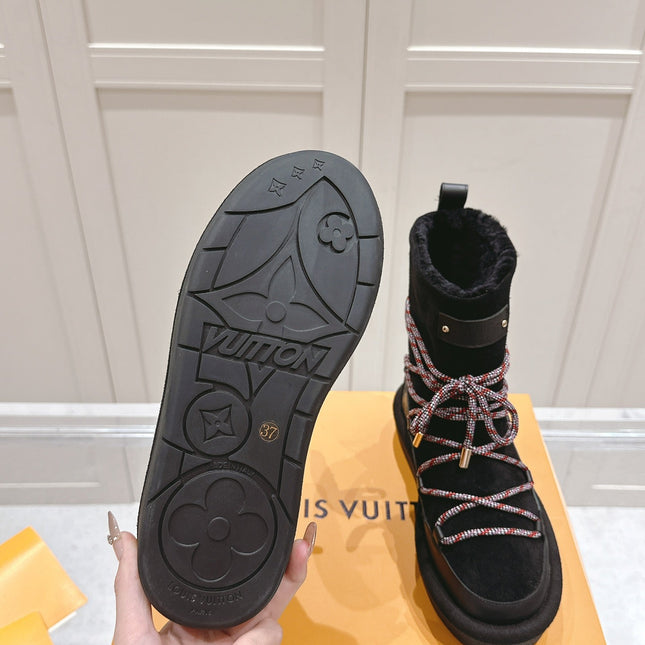 ASPEN PLATFORM ANKLE BOOT IN BLACK MONOGRAM DEBOSSED SUEDE AND SHEARLING
