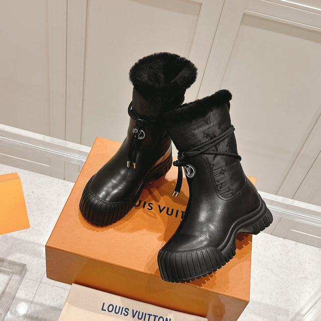 RUBY FLAT ANKLE BOOT IN BLACK CALFSKIN AND MONOGRAM NYLON