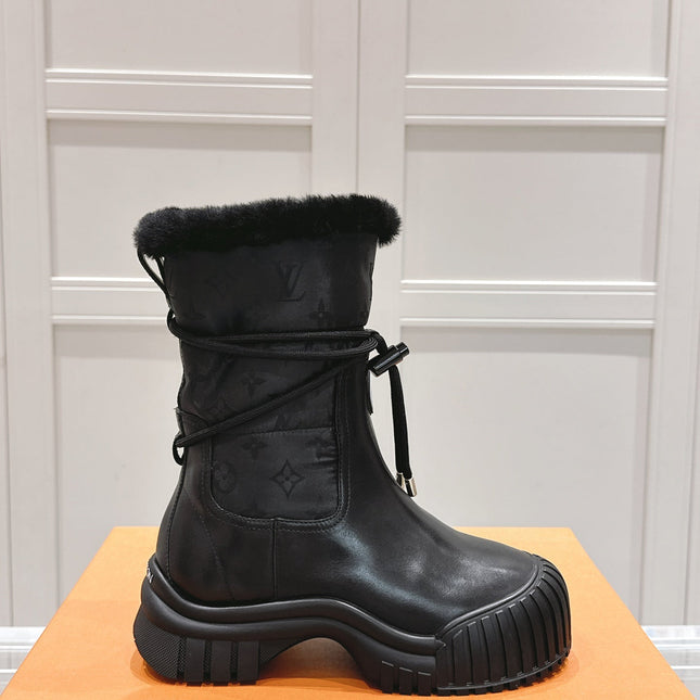 RUBY FLAT ANKLE BOOT IN BLACK CALFSKIN AND MONOGRAM NYLON