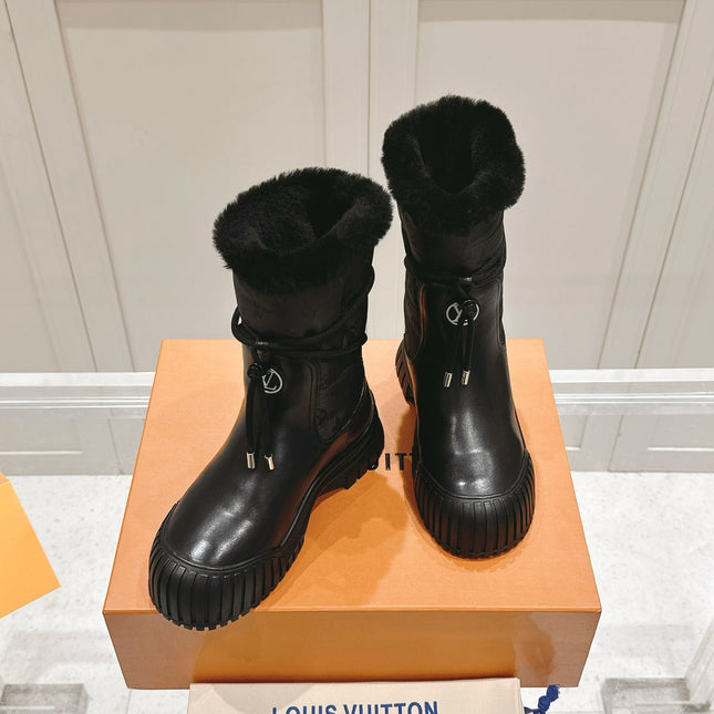 RUBY FLAT ANKLE BOOT IN BLACK CALFSKIN AND MONOGRAM NYLON