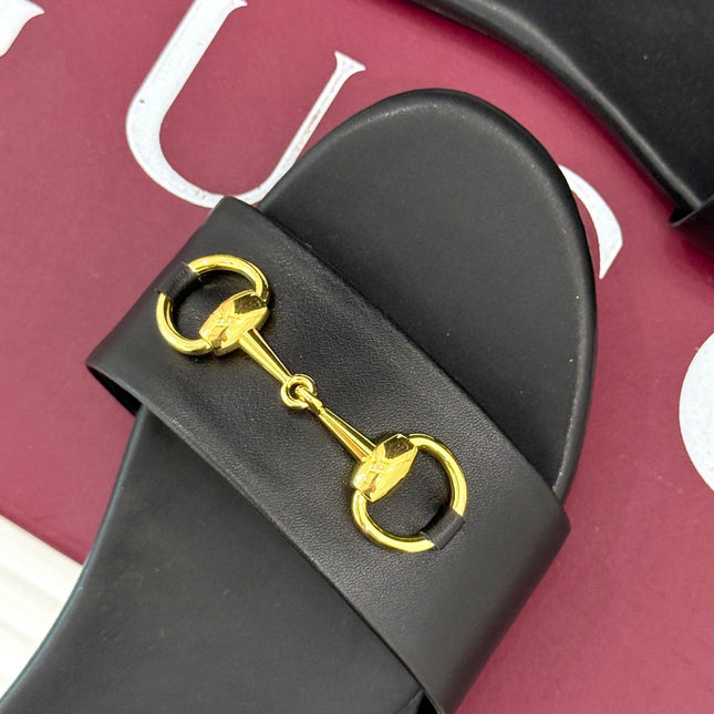 SLIDE SANDALS IN BLACK CALFSKIN WITH GOLD HARDWARE