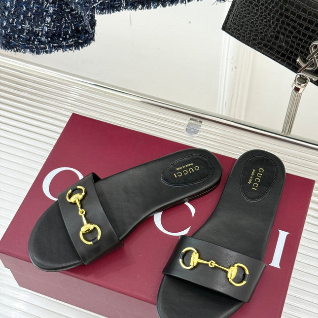 SLIDE SANDALS IN BLACK CALFSKIN WITH GOLD HARDWARE