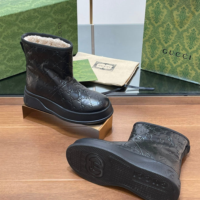GG UGG BOOTS IN BLACK EMBOSSED SUEDE AND BEIGE WOOL LINING