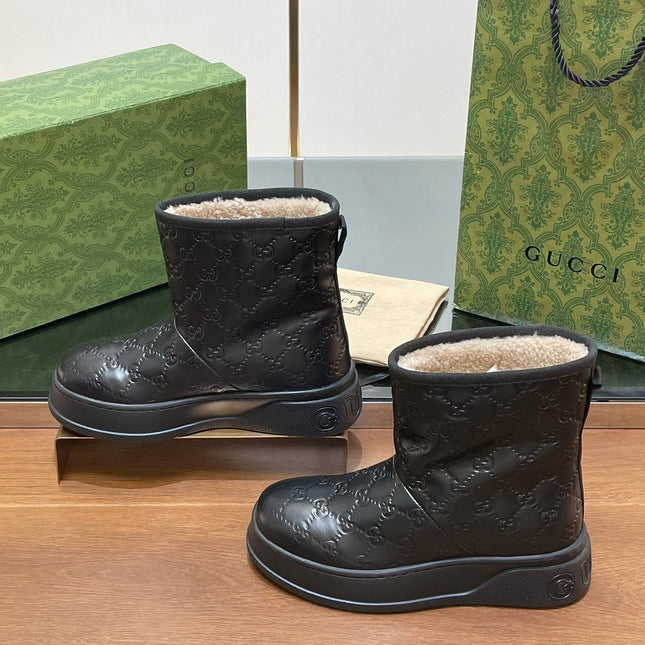 GG UGG BOOTS IN BLACK EMBOSSED DEERSKIN AND BEIGE WOOL LINING