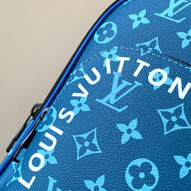 AVENUE SLINGBAG 31 IN BLUE AND BROWN TAIGA LEATHER