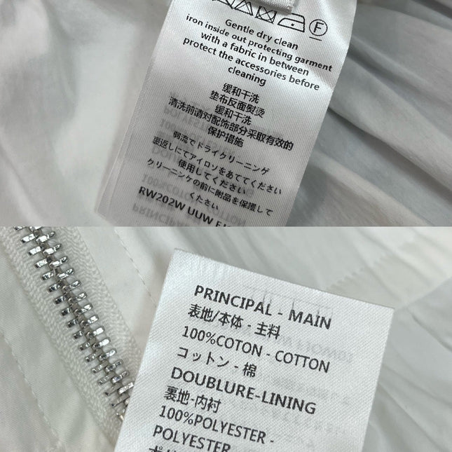 HIGH-NECK SLEEVELESS TOP WITH ZIP CLOSURE