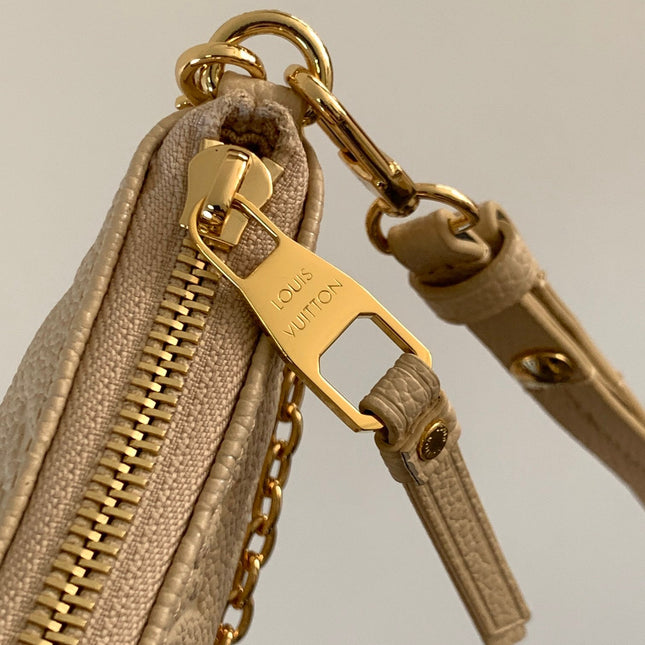 EASY POUCH ON STRAP 19 IN BEIGE MONOGRAM EMPREINTE LEATHER