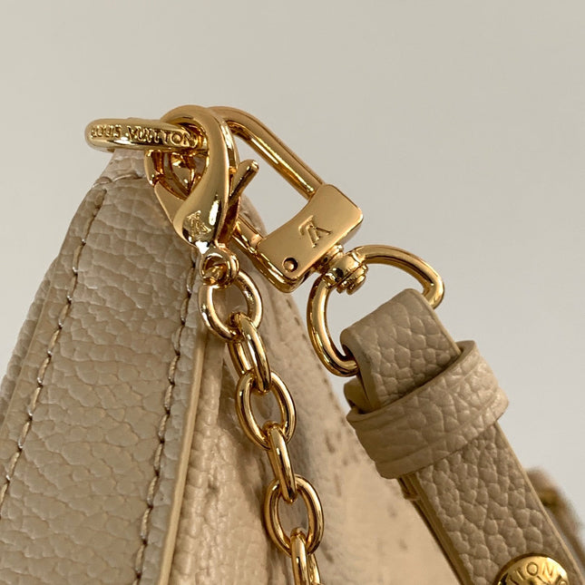 EASY POUCH ON STRAP 19 IN BEIGE MONOGRAM EMPREINTE LEATHER