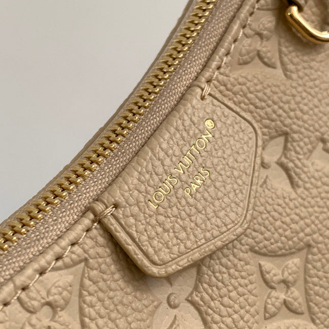 EASY POUCH ON STRAP 19 IN BEIGE MONOGRAM EMPREINTE LEATHER