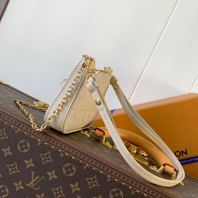 EASY POUCH ON STRAP 19 IN BEIGE MONOGRAM EMPREINTE LEATHER