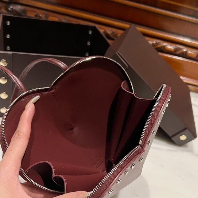 LE COEUR BAG 21 IN BURGUNDY RED CALFSKIN WITH STUDDED HEART