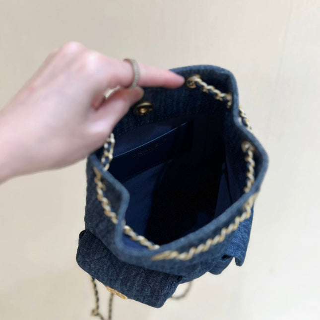 DRAWSTRING BUCKET BACKPACK 24 IN DARK BLUE DENIM GOLD HARDWARE