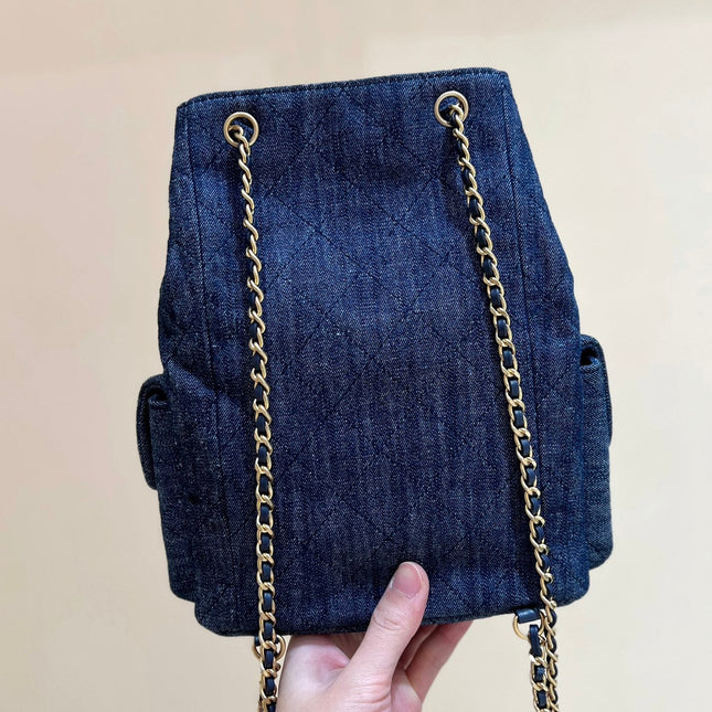DRAWSTRING BUCKET BACKPACK 24 IN DARK BLUE DENIM GOLD HARDWARE