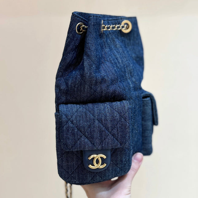 DRAWSTRING BUCKET BACKPACK 24 IN DARK BLUE DENIM GOLD HARDWARE