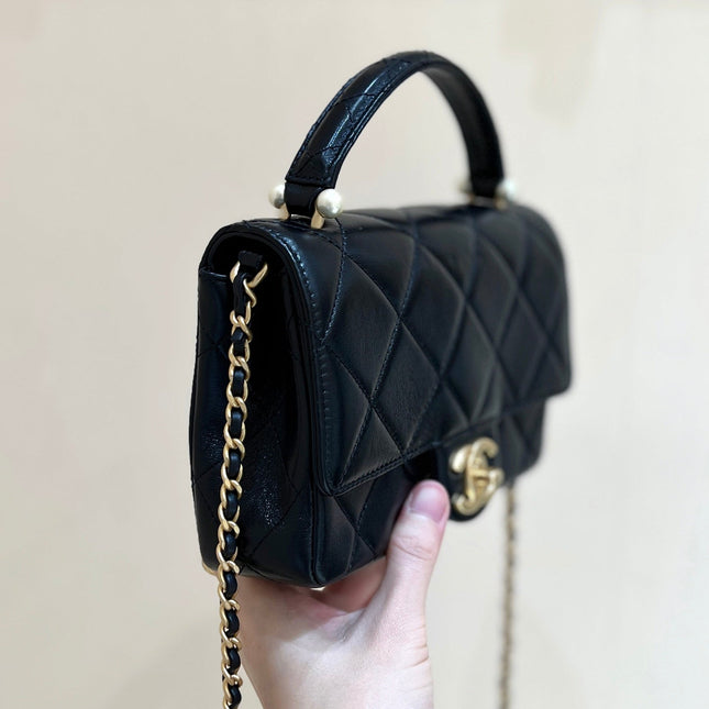 PEARL LIMITED EDITION FLAP BAG WITH HANDLE 20 IN BLACK LAMBSKIN