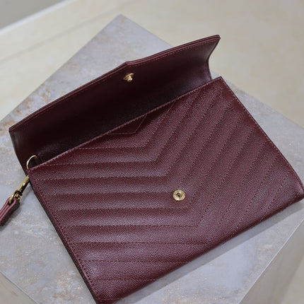 CASSANDRE CLUTCH 21 IN BORDEAUX RED LAMBSKIN GOLD HARDWARE